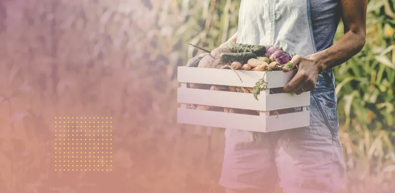 Person carrying a basket of vegetables.
