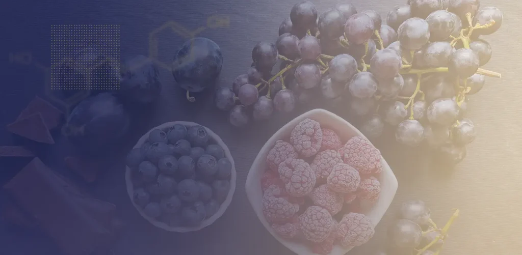 Bowls of berries, including raspberries, blueberries, and grapes.
